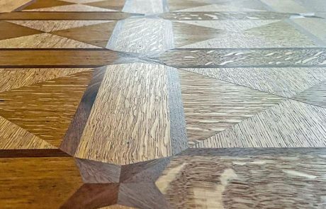 Geometric parquet floor restoration Restored geometric parquet flooring in Newcastle upon Tyne
