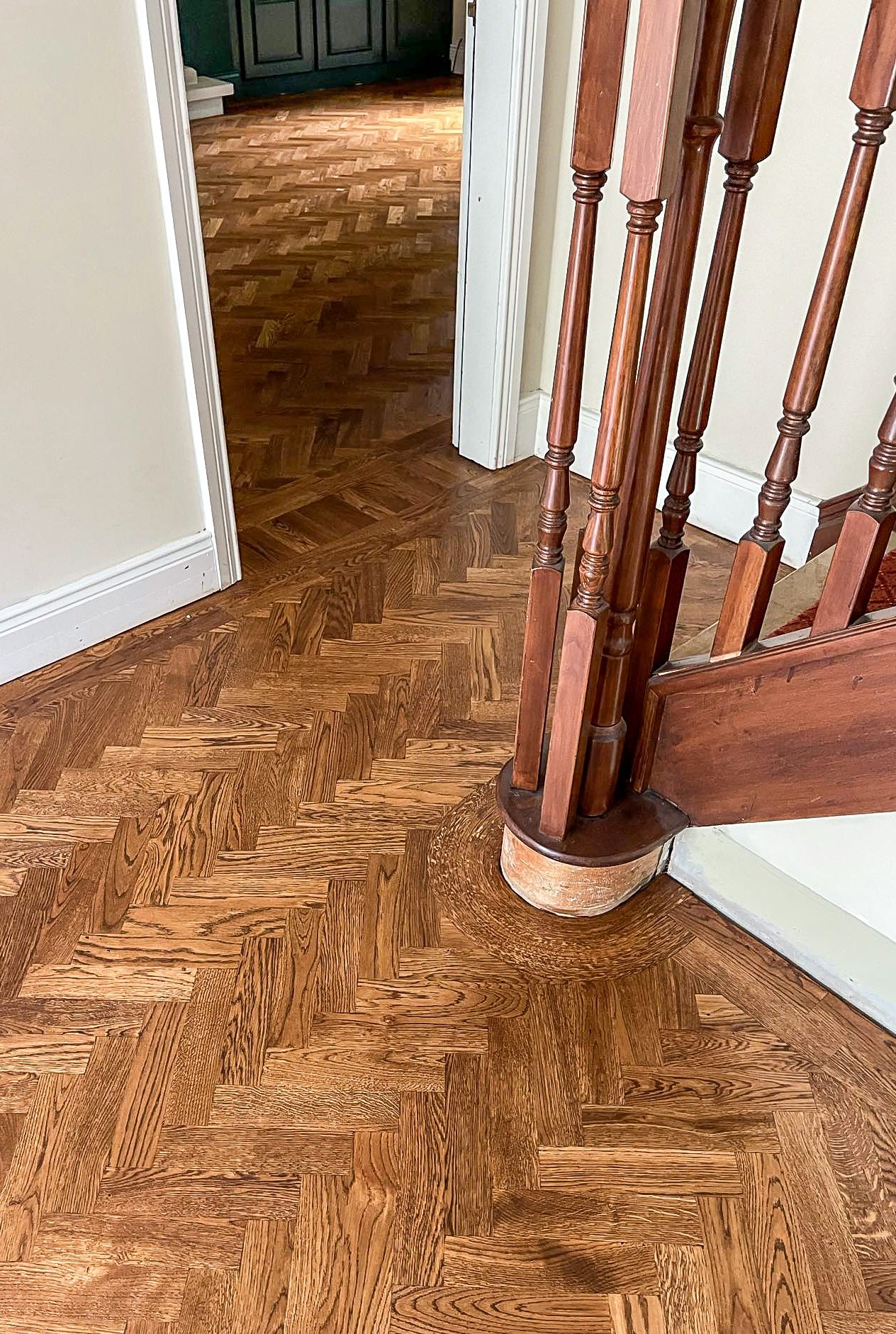 Parquet Flooring With Curved Border Parquet flooring installation with curved timber border around staircase