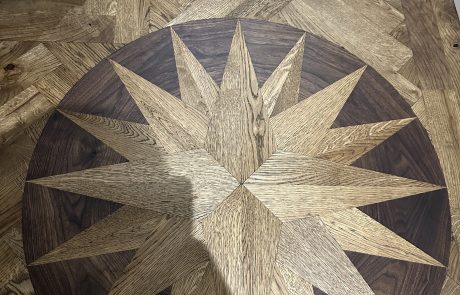 Bespoke timber floor medallion Handmade timber medallion inlay created within a parquet floor