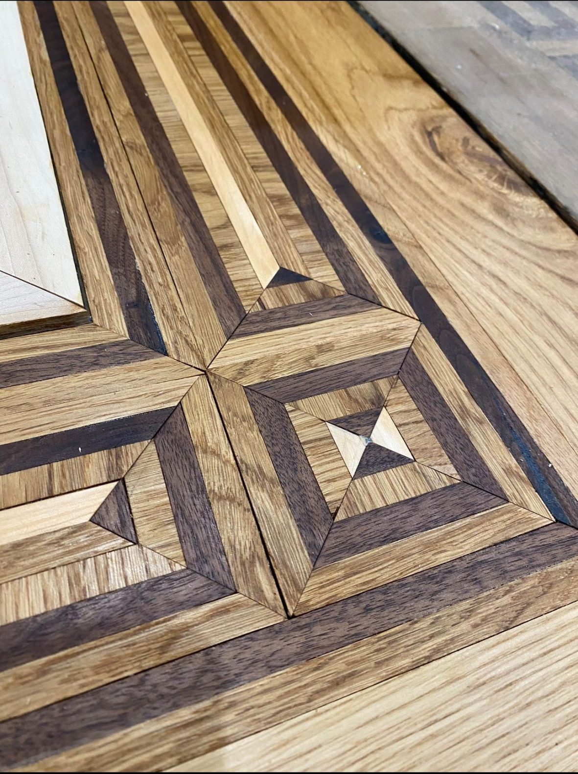 Handmade Multi-Species Parquet Border Handmade multi-species wood floor border with geometric corner detail