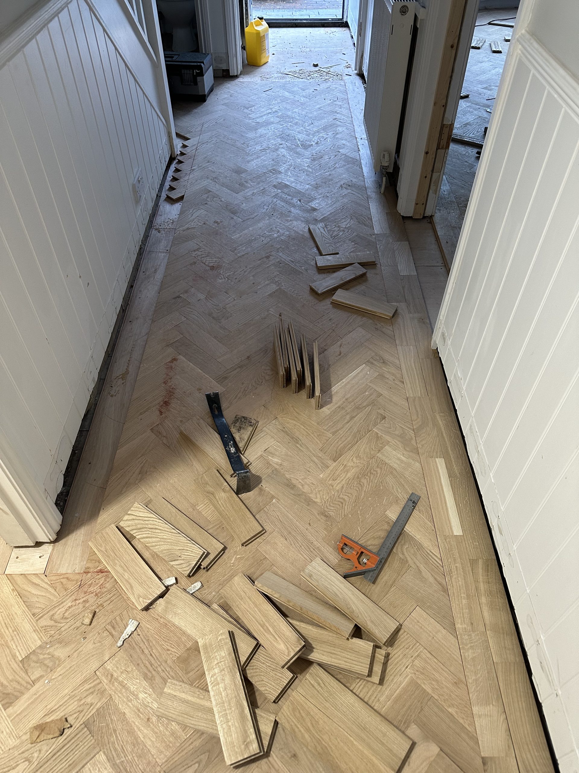 Oak parquet border being dry fitted from corner to corner before fixing