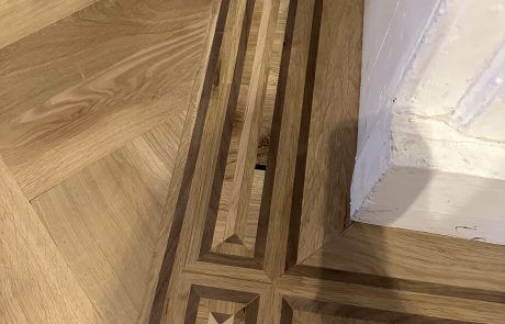 Handmade bespoke parquet border Handmade multi-species timber border created around a parquet floor
