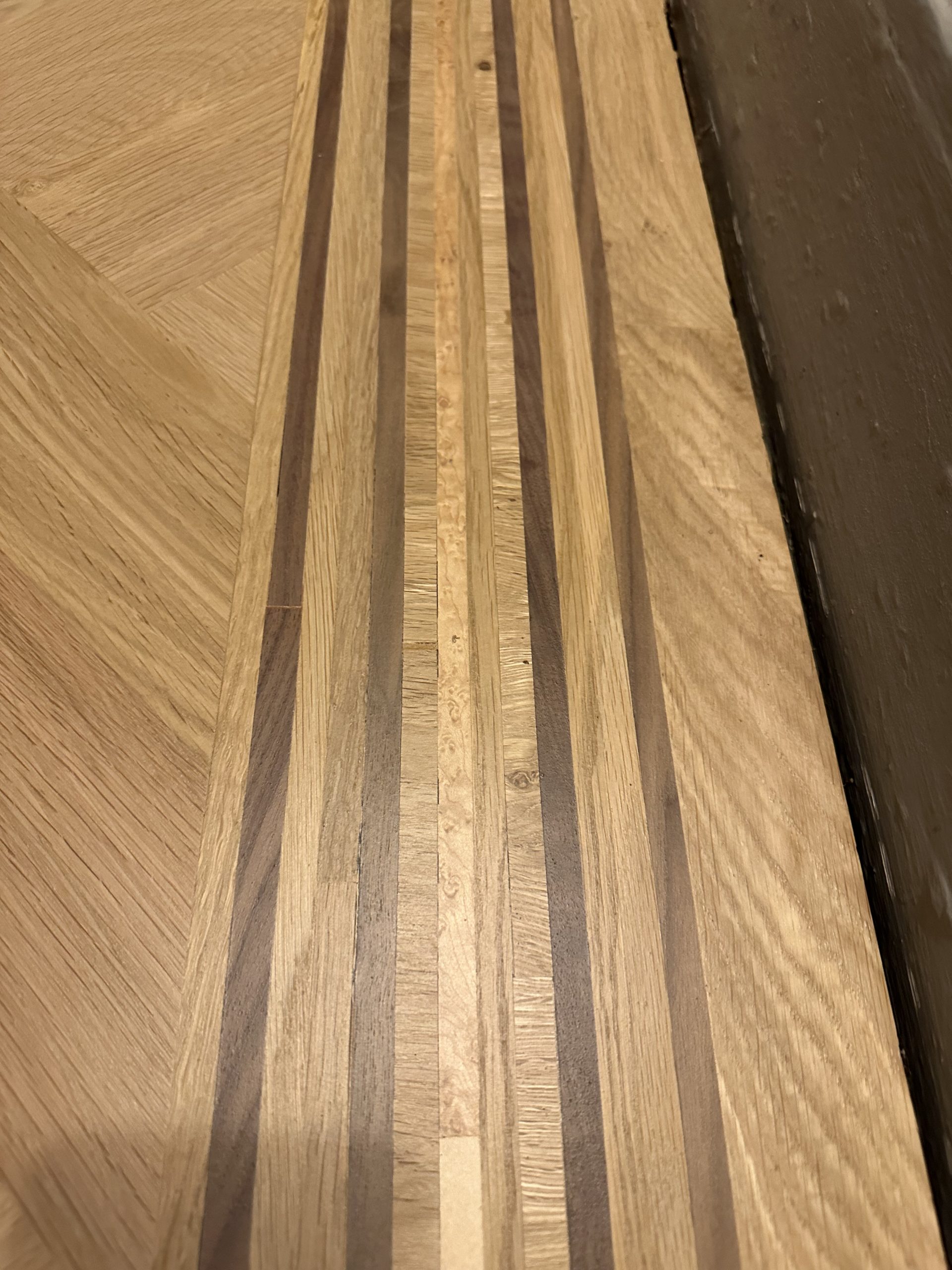 Handmade Multi-Species Parquet Border Handmade multi-species border alongside oversized oak parquet flooring