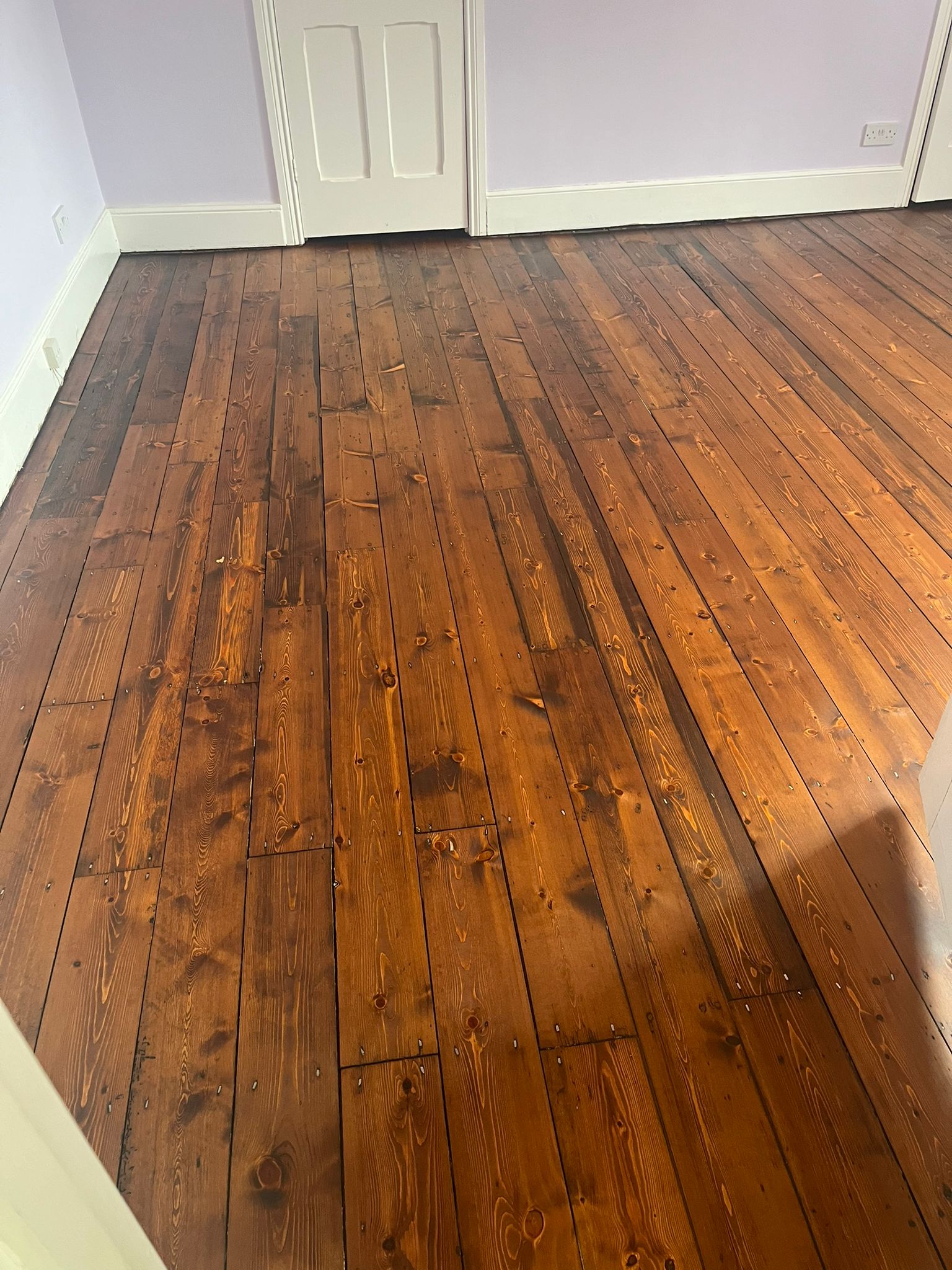 Restored Softwood Floor After Reclaimed Timber Repair Finished original softwood floor after reclaimed timber repair and restoration