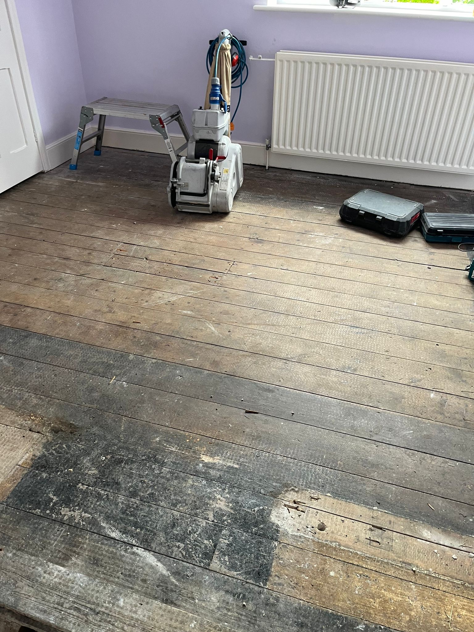 Sanding Softwood Floorboards – Riding Mill Original and reclaimed softwood floorboards being sanded during restoration in Riding Mill