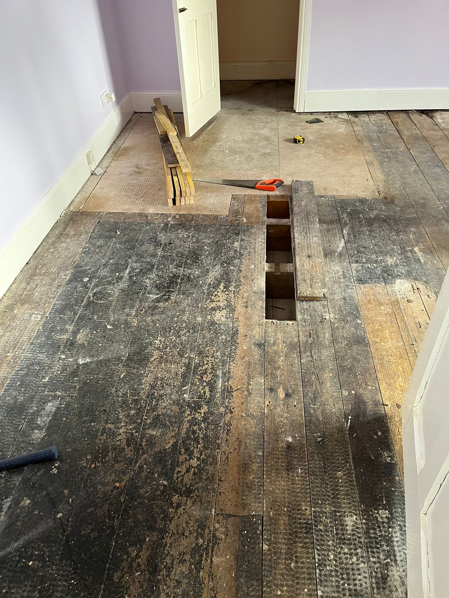 Original Softwood Floor Before Restoration – Riding Mill Original softwood floorboards before repairs and restoration in a Riding Mill home