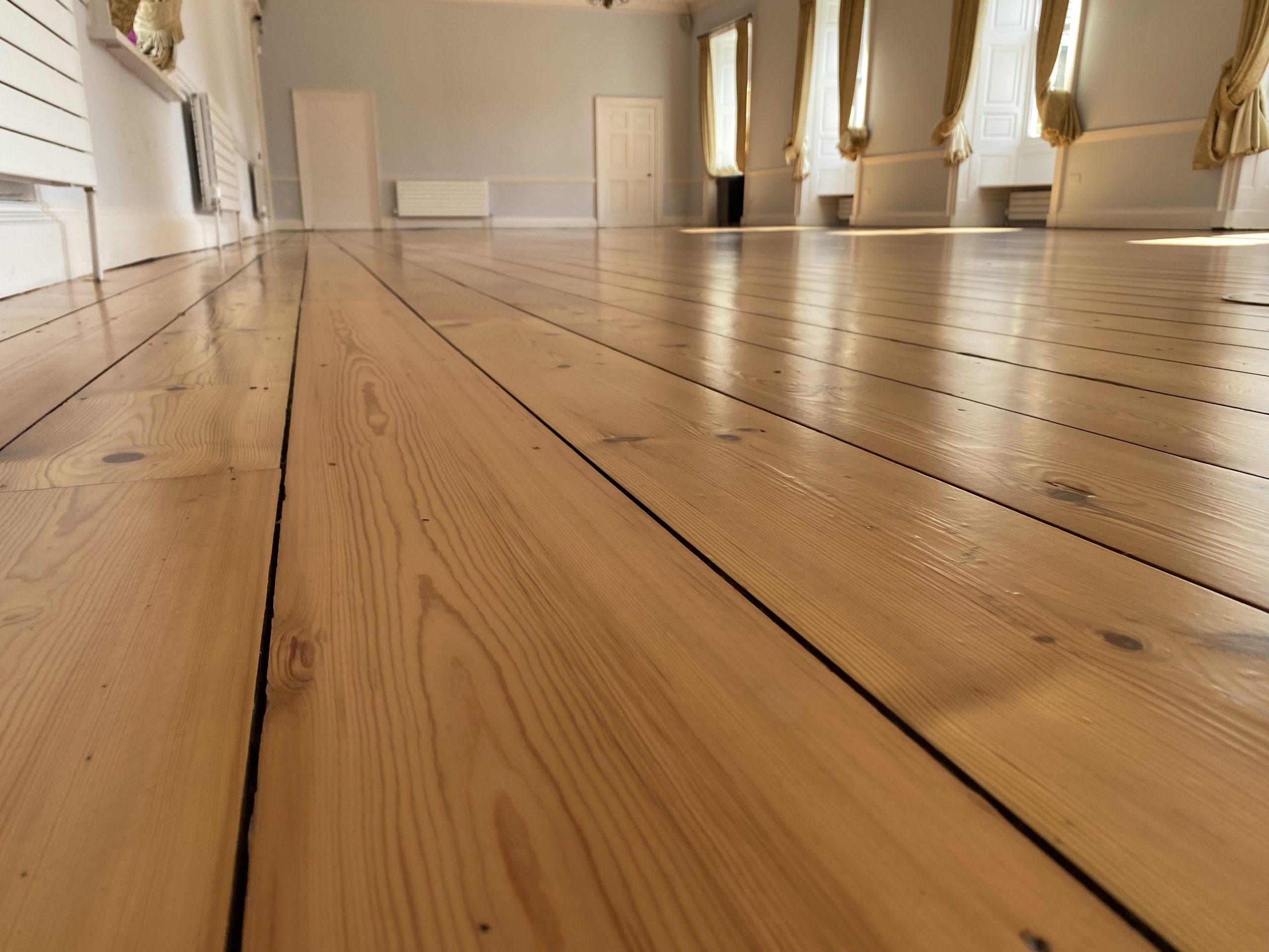 Close view of restored original floorboards at Hexham Abbey