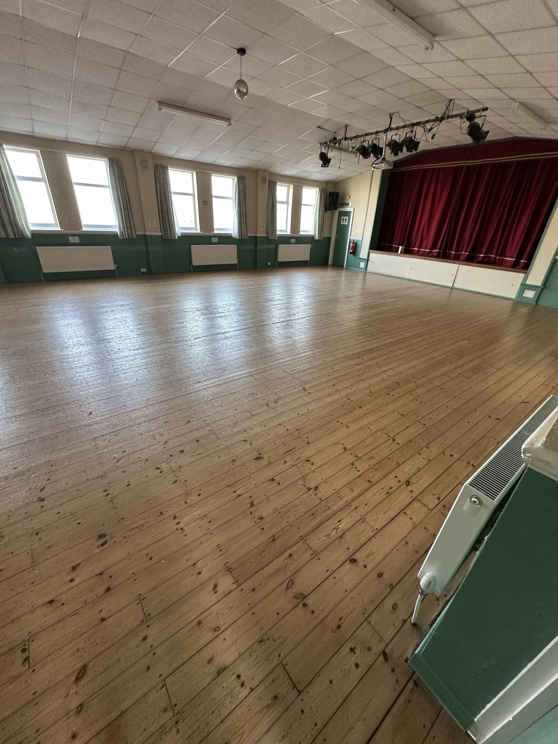 St Bede’s Church Hall Floor Before Restoration – Blyth Worn softwood floor before restoration at St Bede’s Church Hall in Blyth