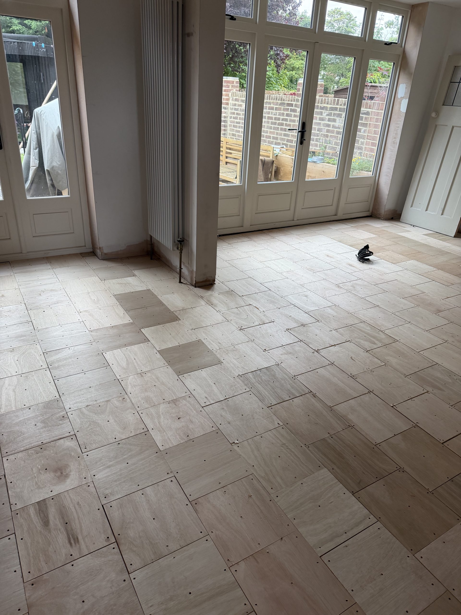Subfloor Preparation for Herringbone Flooring – Tynemouth Plywood subfloor preparation across the ground floor before solid oak herringbone flooring installation in Tynemouth