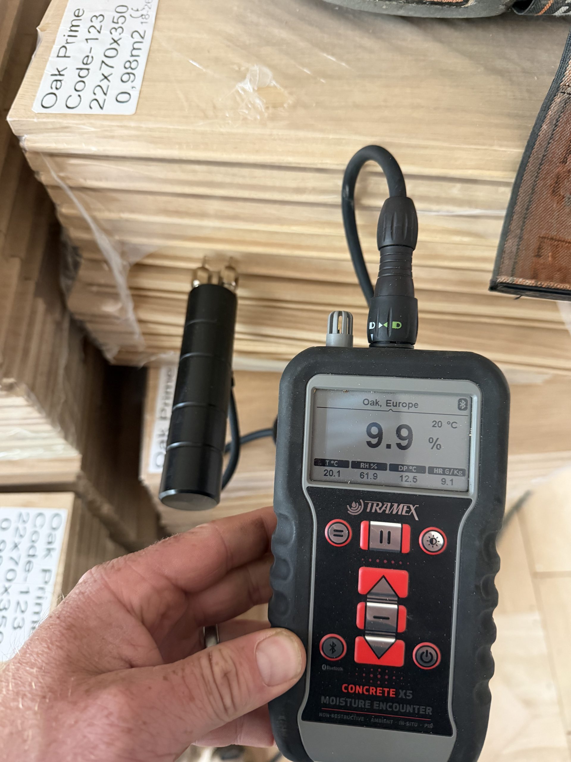 Solid Oak Flooring Moisture Check – Tynemouth Moisture content being checked in solid oak herringbone blocks before installation in Tynemouth