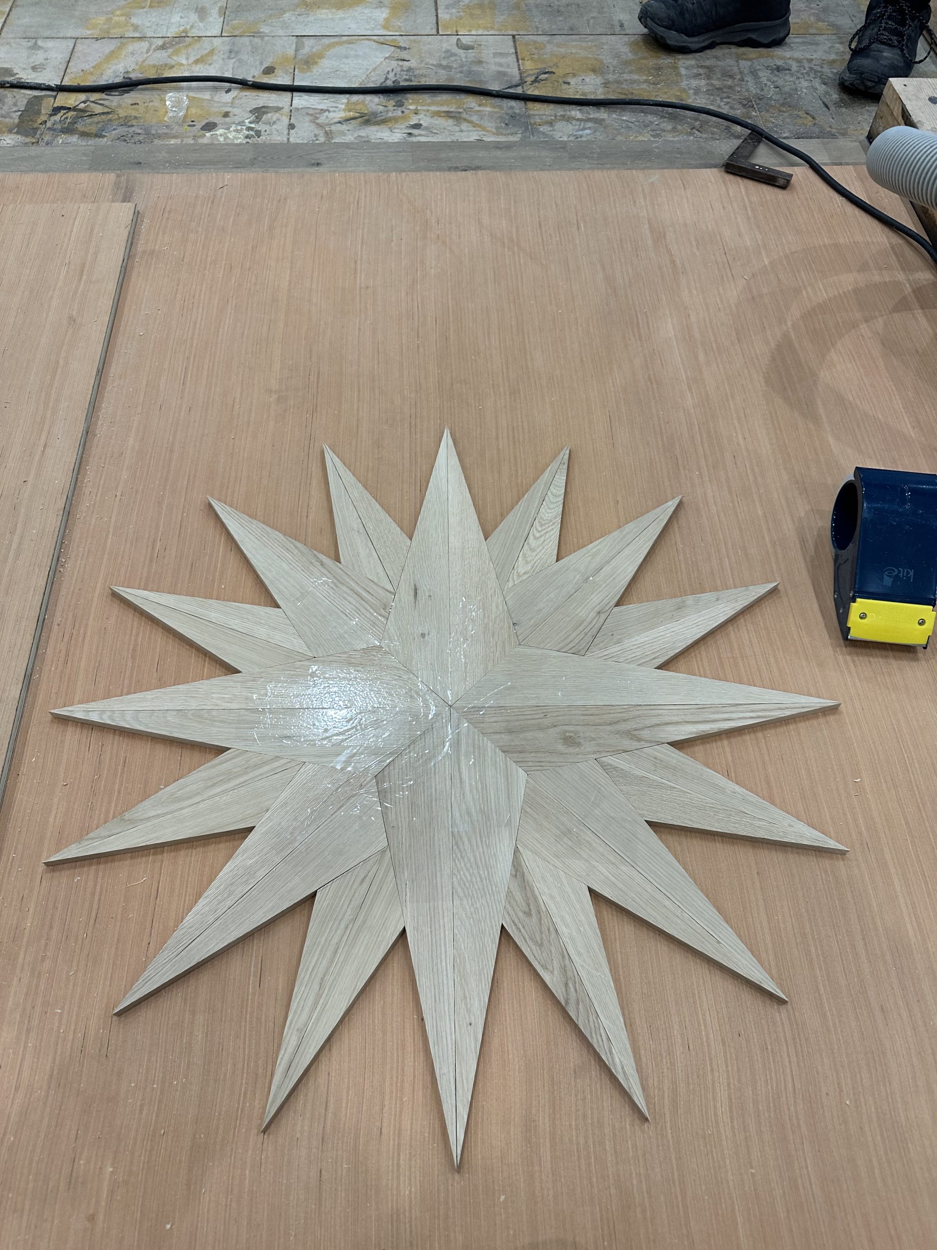 Oak Star Medallion Assembly Oak star being assembled for a handmade floor medallion