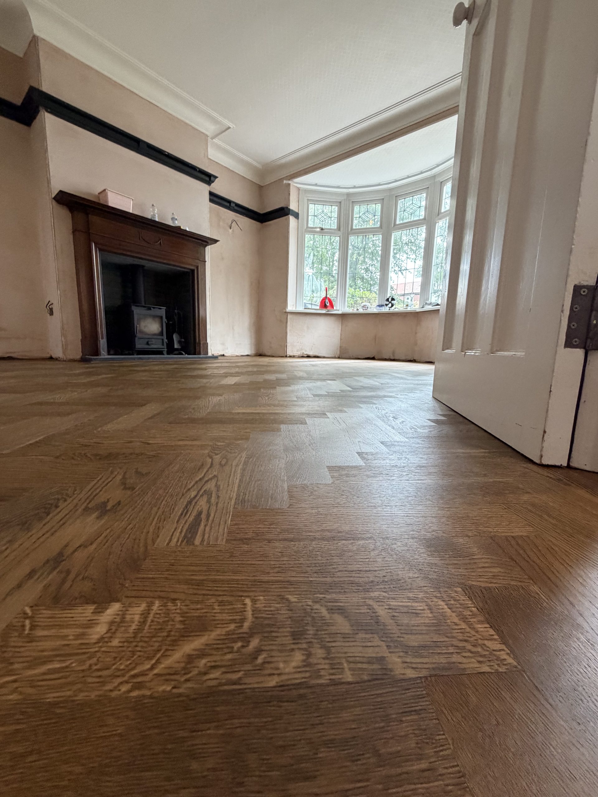 Finished Oak Herringbone Flooring Through Doorway – Tynemouth Finished solid oak herringbone flooring continuing through a doorway in a Tynemouth home