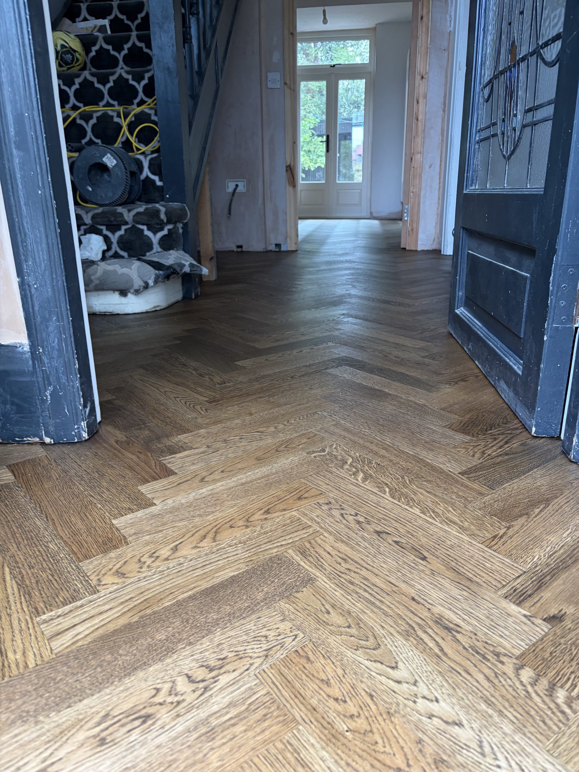 Finished Oak Herringbone Flooring in Hallway – Tynemouth Finished solid oak herringbone flooring running through the hallway of a Tynemouth home