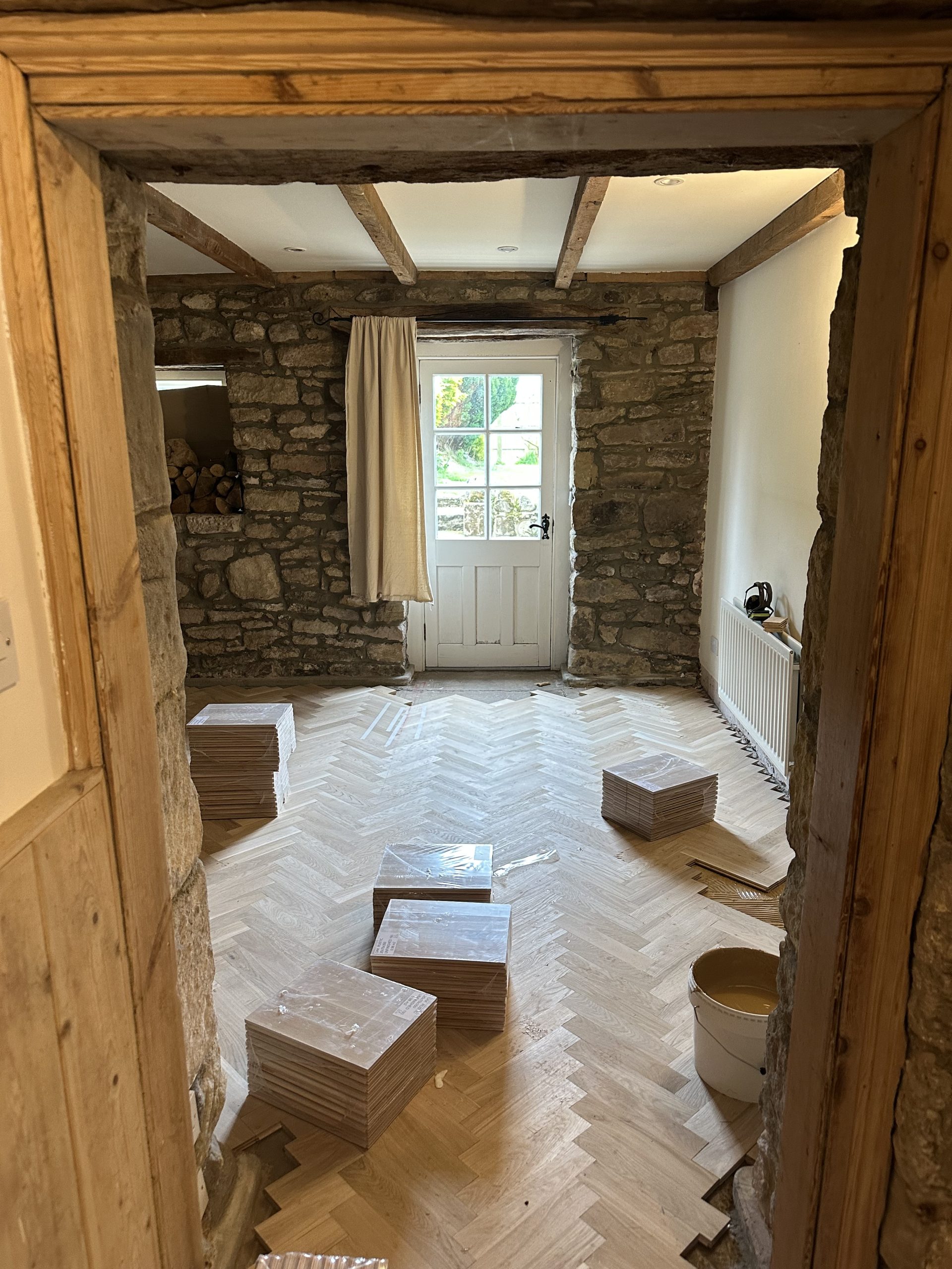 Oak Herringbone Flooring Installation – Seahouses Oak herringbone flooring being installed in a stone-built property in Seahouses, Northumberland