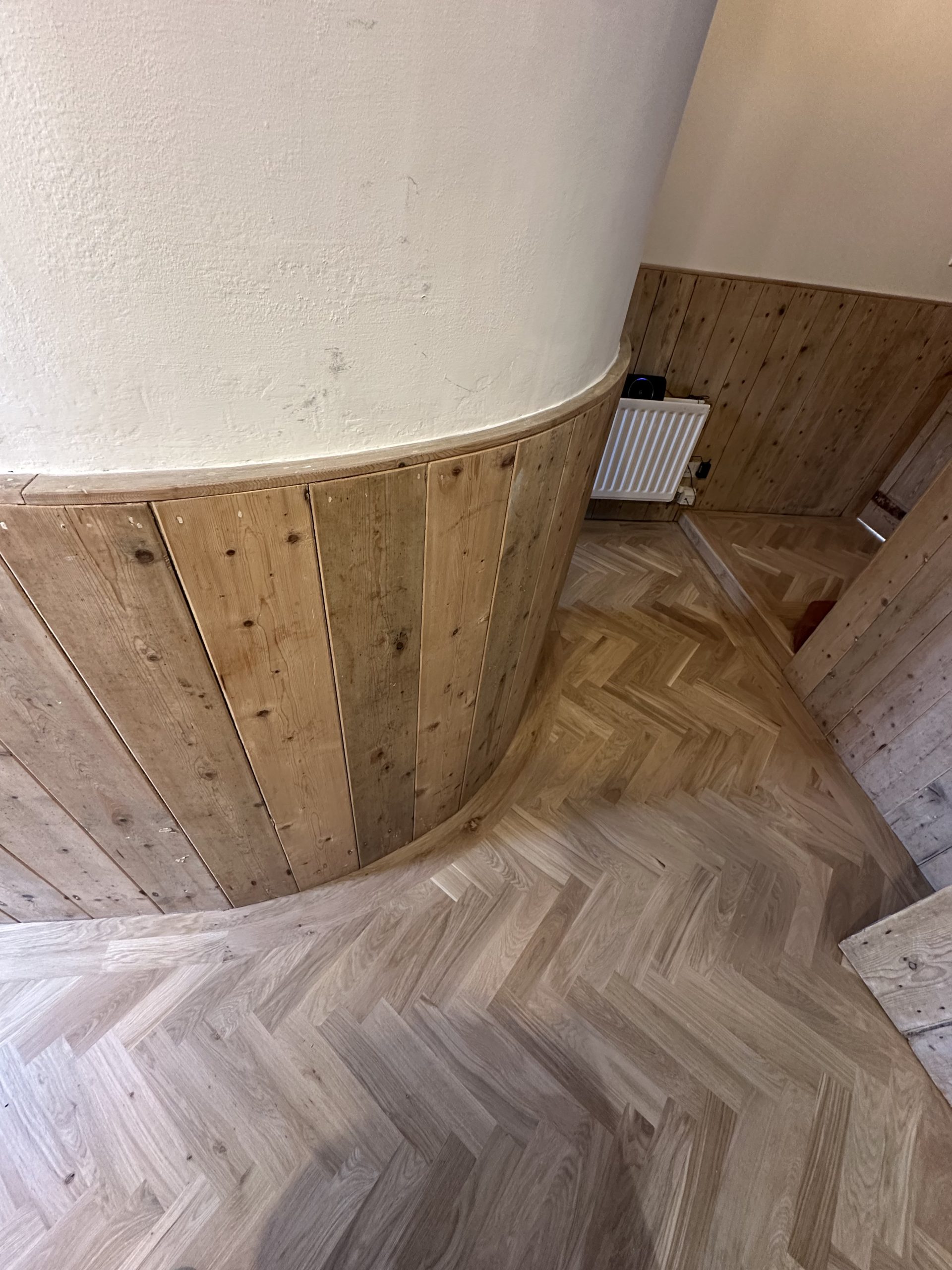 Finished Oak Herringbone Entrance Flooring – Seahouses Oak herringbone flooring installed through the entrance of a stone-built property in Seahouses