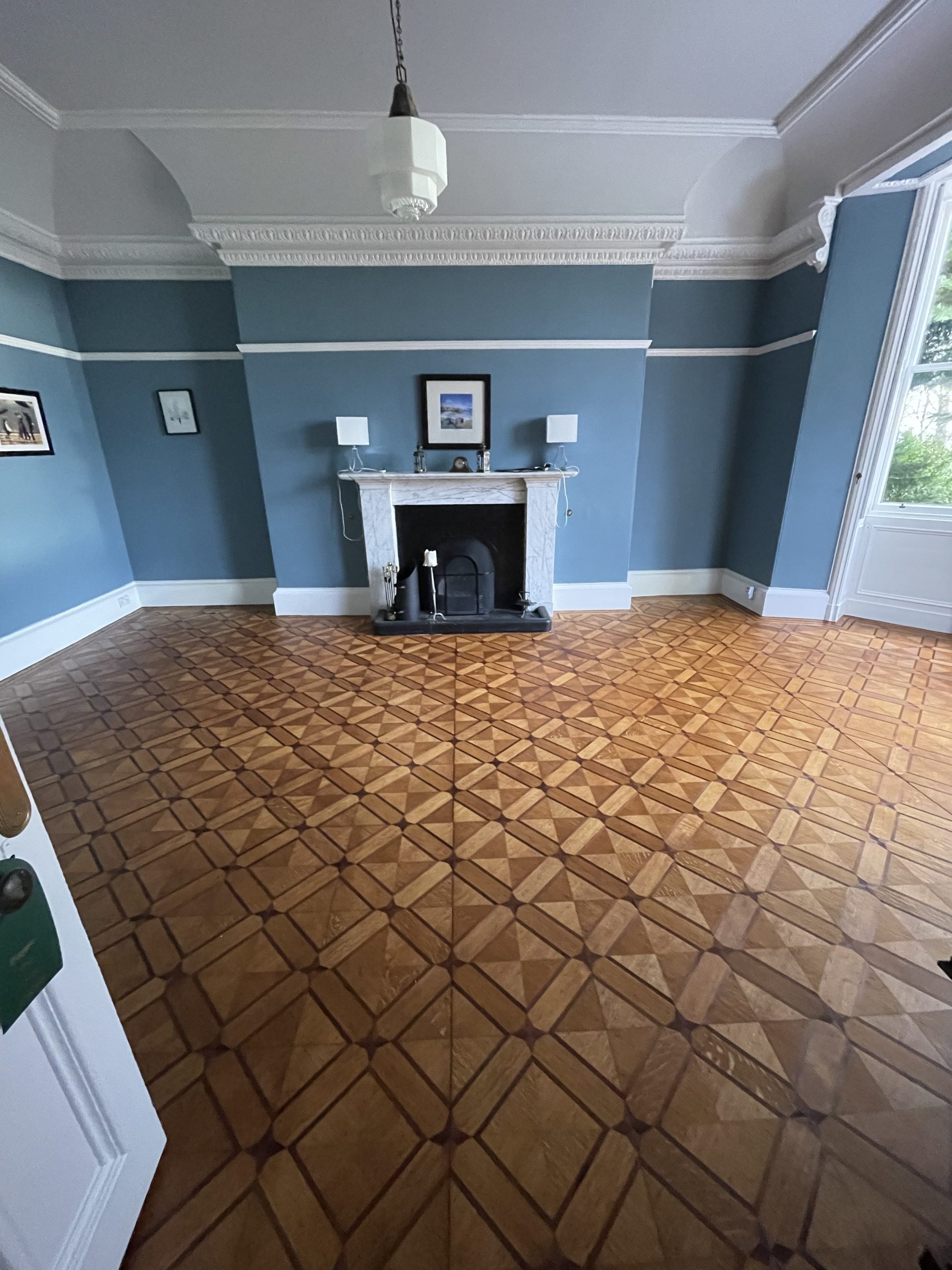 Restored geometric parquet flooring with decorative timber pattern in a period property near Berwick-upon-Tweed