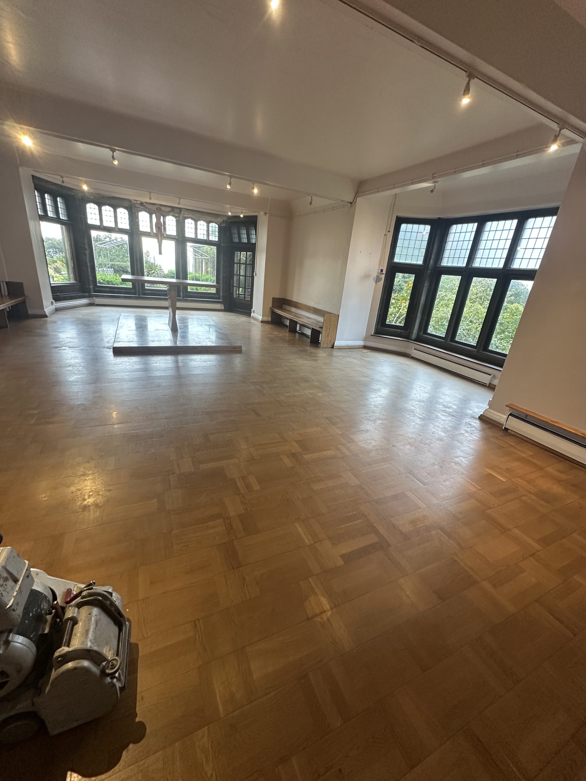 Worn parquet flooring before restoration at The Friary in Alnmouth
