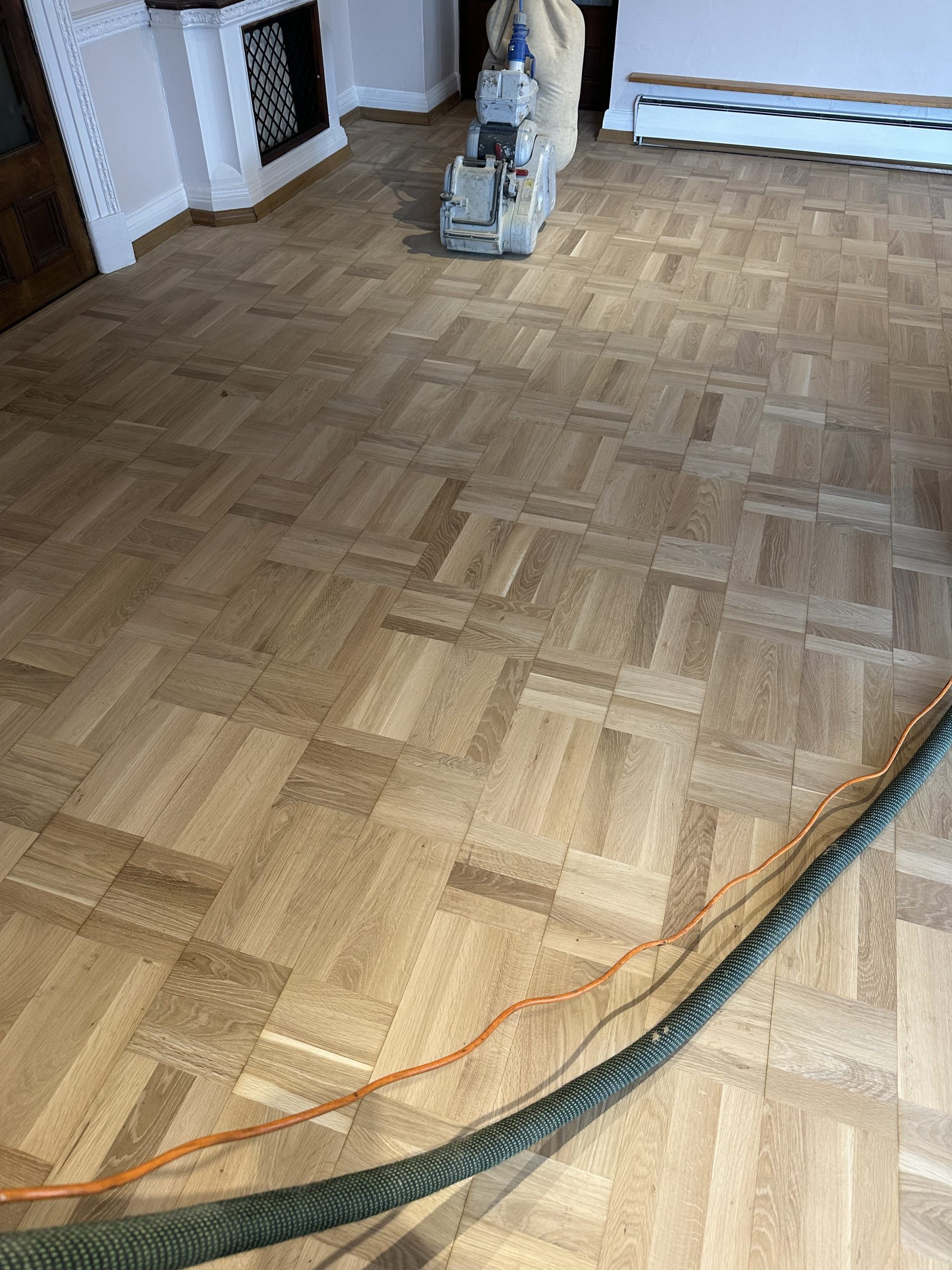 Parquet flooring being professionally sanded at The Friary in Alnmouth