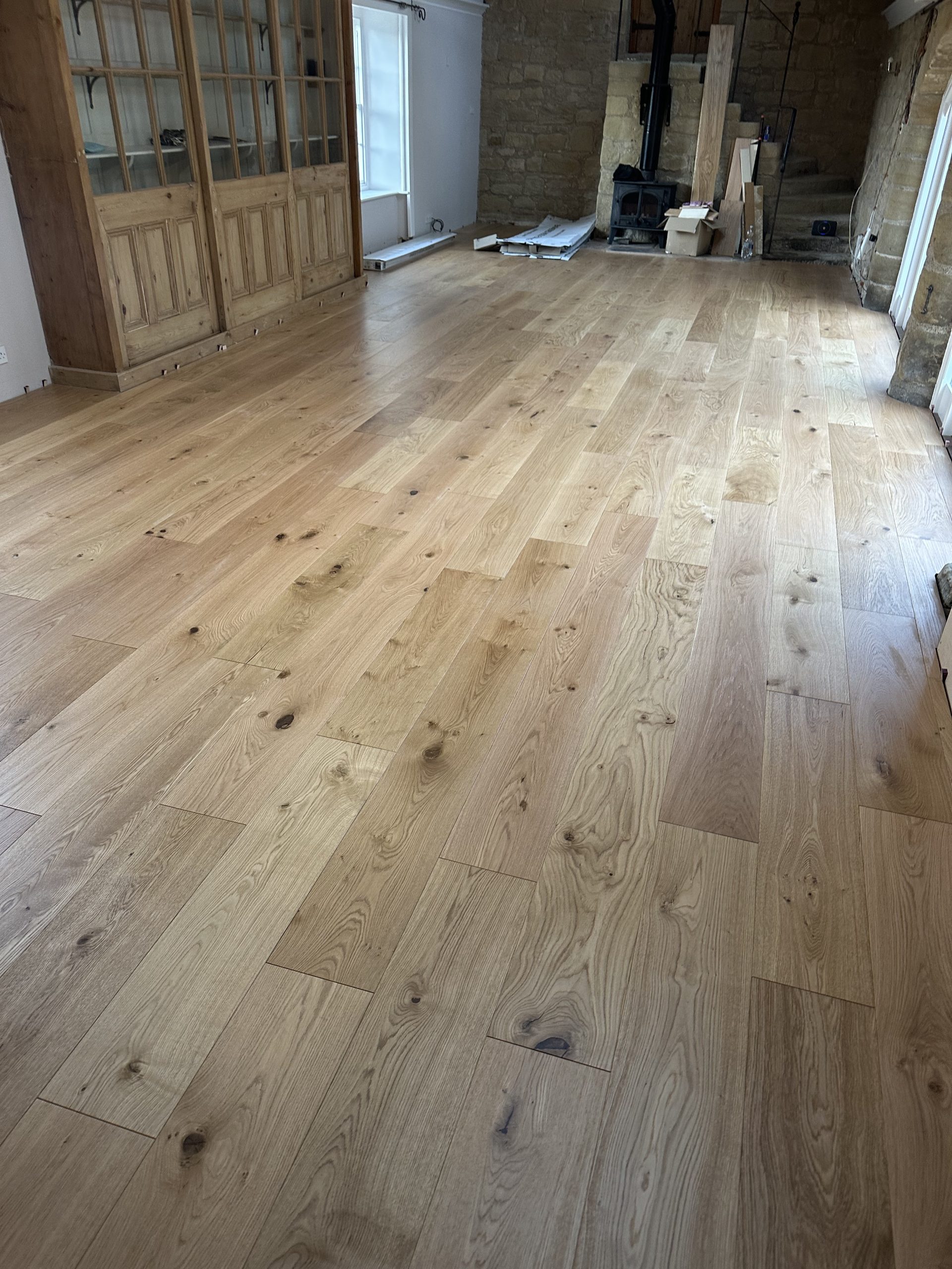 Close view of wide engineered oak planks showing natural grain and knots in a High Buston property