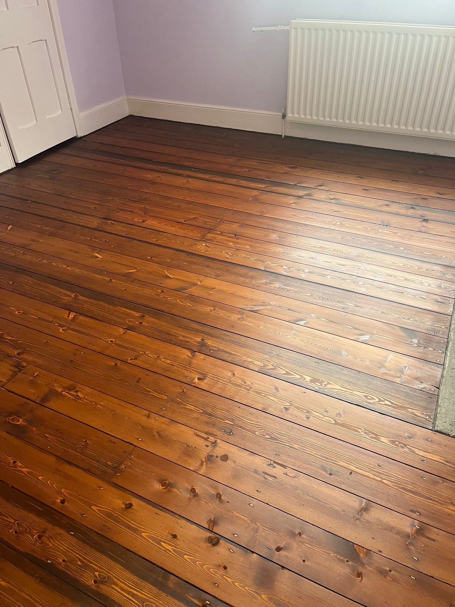 Finished original softwood flooring after restoration and coloured 2K oil treatment in Riding Mill